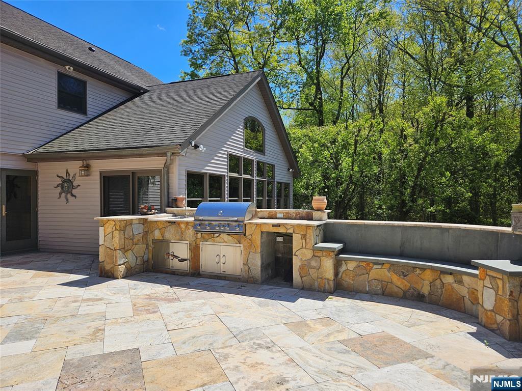 285 Chestnut Ridge Road Woodcliff Lake, NJ 07677 - Photo 8 of 46 a view of house and yard with swimming pool