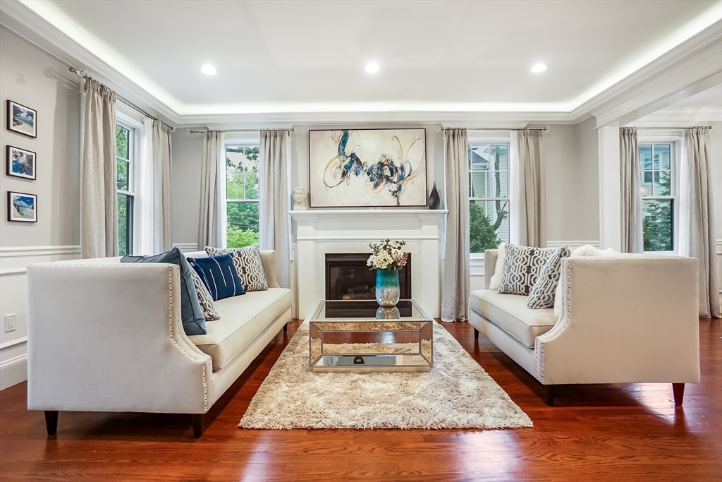 57 Walnut Street Newton, MA 02460 - Photo 11 of 42 a living room with furniture and a fireplace