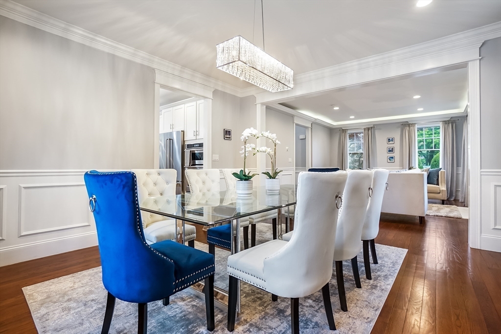 57 Walnut Street Newton, MA 02460 - Photo 14 of 42 a view of a dining room with furniture and wooden floor