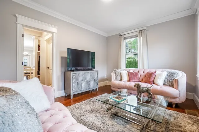 a bathroom with a toilet a sink a glass door a shower a mirror and vanity