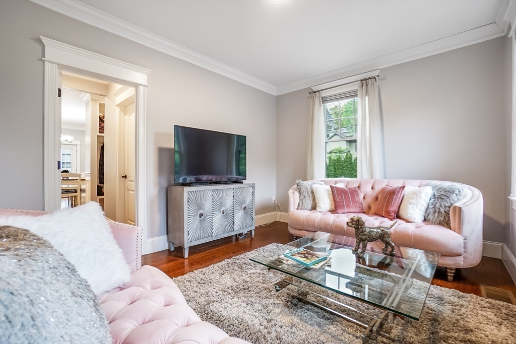 57 Walnut Street Newton, MA 02460 - Photo 15 of 42 a living room with furniture and a flat screen tv