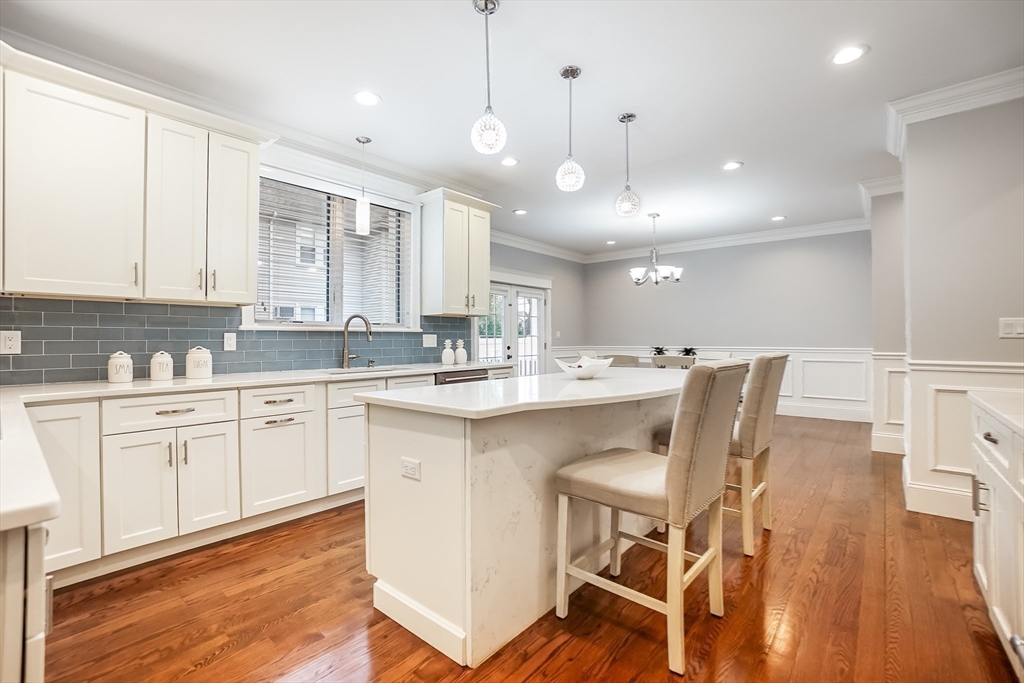 57 Walnut Street Newton, MA 02460 - Photo 19 of 42 a large white kitchen with a large window