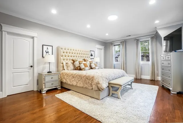 a bedroom with a bed and a couch