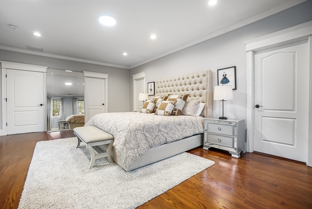 57 Walnut Street Newton, MA 02460 - Photo 22 of 42 a bedroom with a bed and a couch