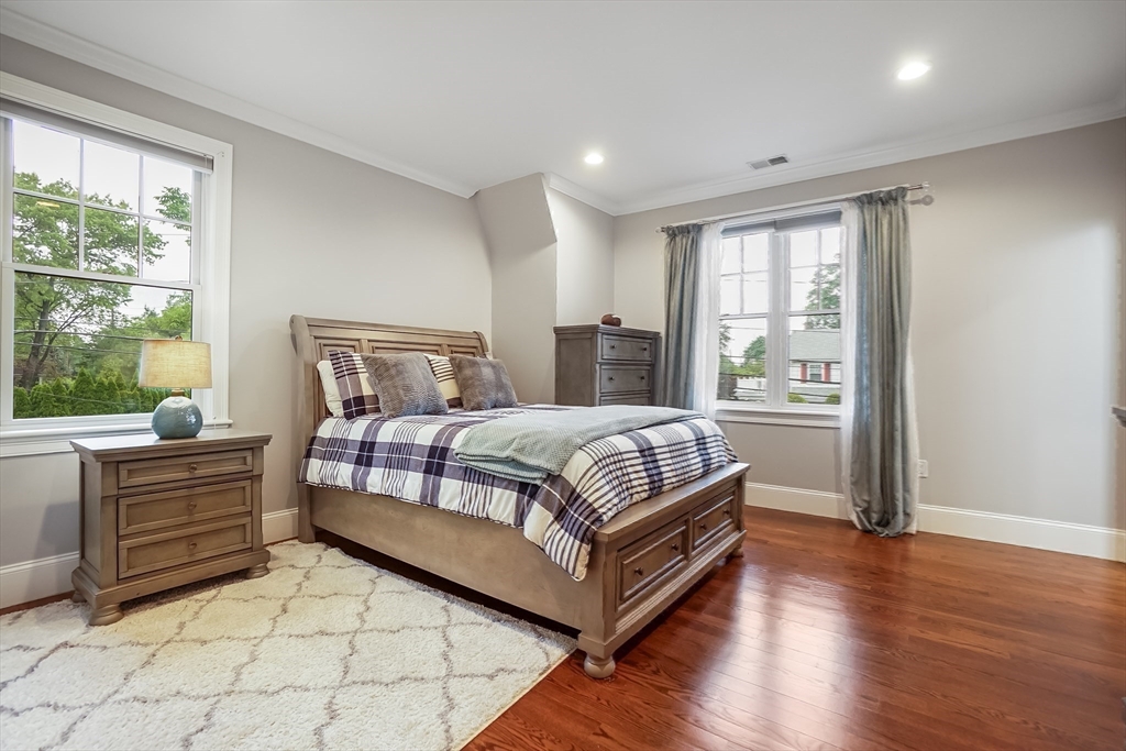 57 Walnut Street Newton, MA 02460 - Photo 27 of 42 a bedroom with a large bed and a window