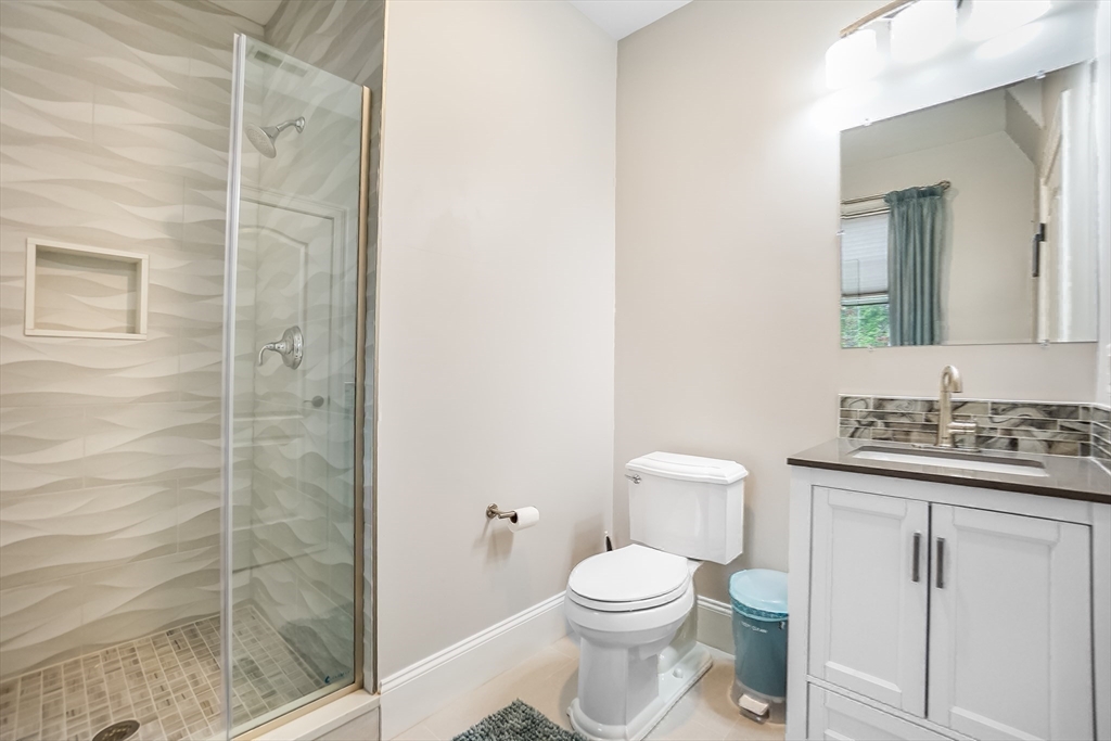 57 Walnut Street Newton, MA 02460 - Photo 29 of 42 a bathroom with a toilet a sink and shower