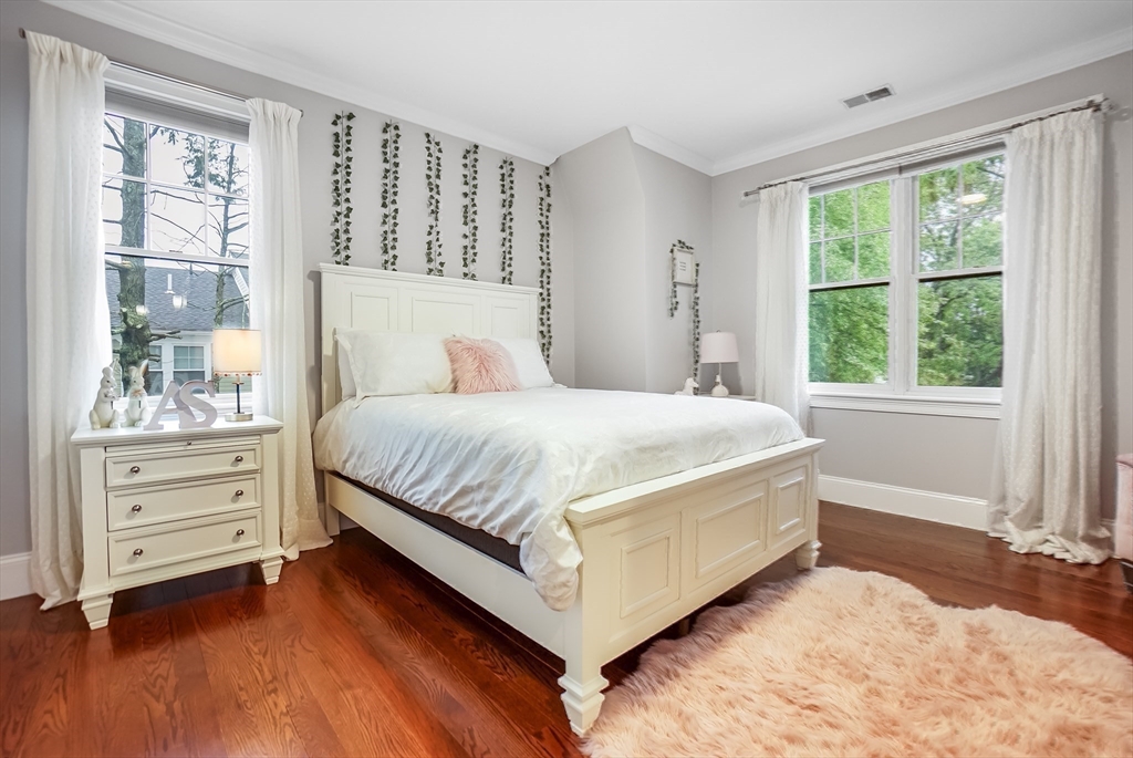 57 Walnut Street Newton, MA 02460 - Photo 30 of 42 a bedroom with a bed and window