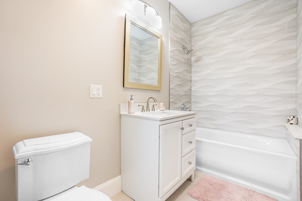 57 Walnut Street Newton, MA 02460 - Photo 32 of 42 a bathroom with a sink a toilet and shower