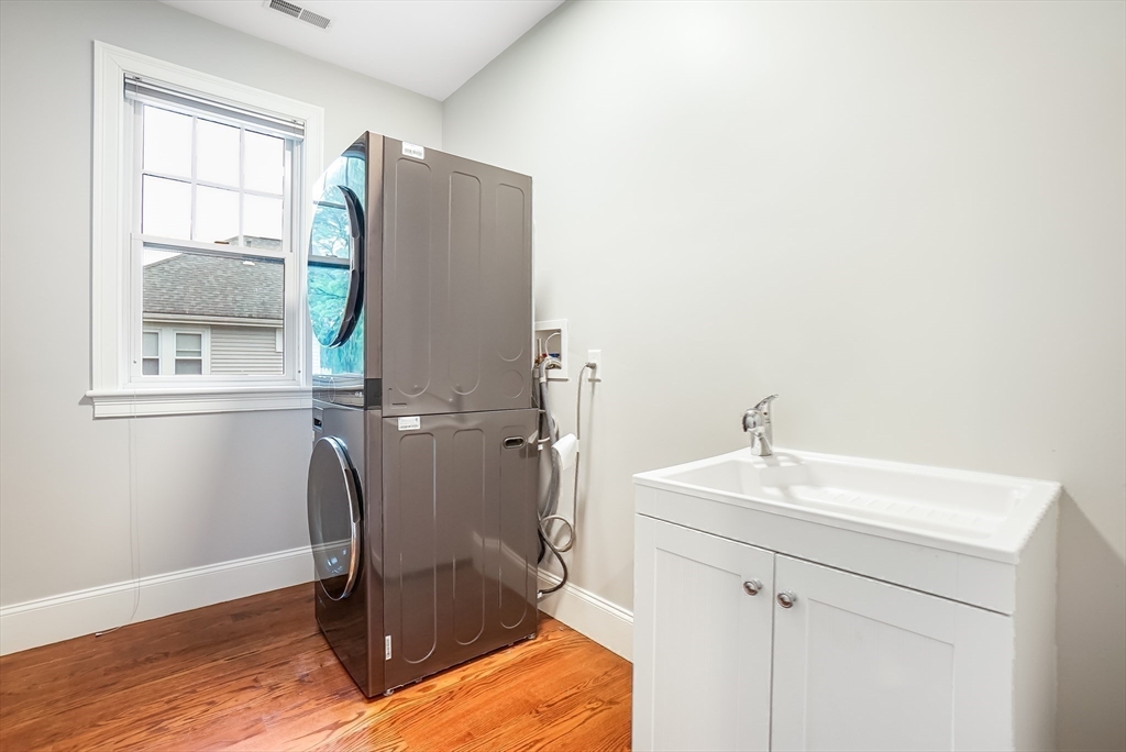 57 Walnut Street Newton, MA 02460 - Photo 33 of 42 a room with a sink and a window