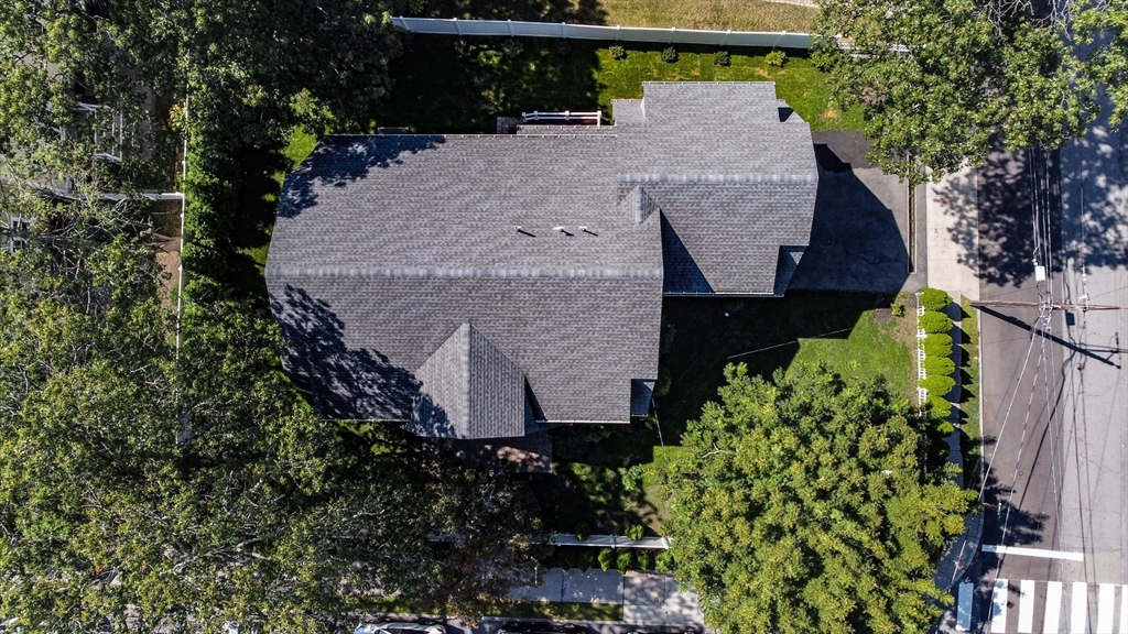 57 Walnut Street Newton, MA 02460 - Photo 39 of 42 an aerial view of a house with a yard and potted plants