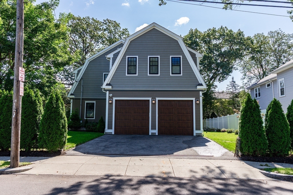 57 Walnut Street Newton, MA 02460 - Photo 7 of 42 a front view of a house with garden