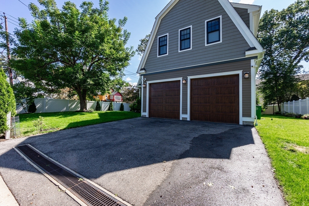 57 Walnut Street Newton, MA 02460 - Photo 8 of 42 a front view of a house with a yard