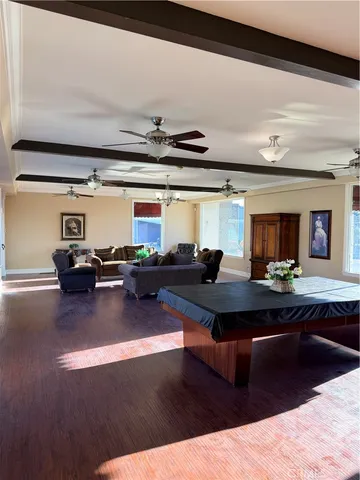 a view of a swimming pool with outdoor seating