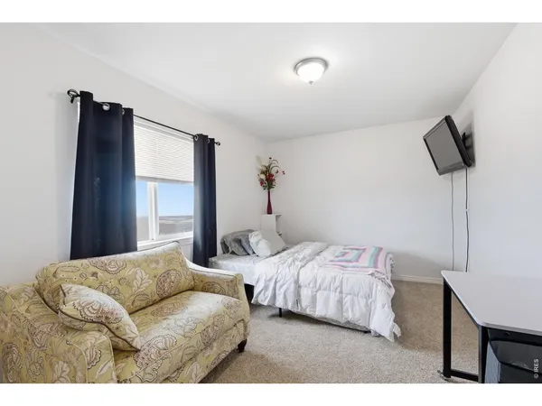 a bedroom with two beds and painted walls