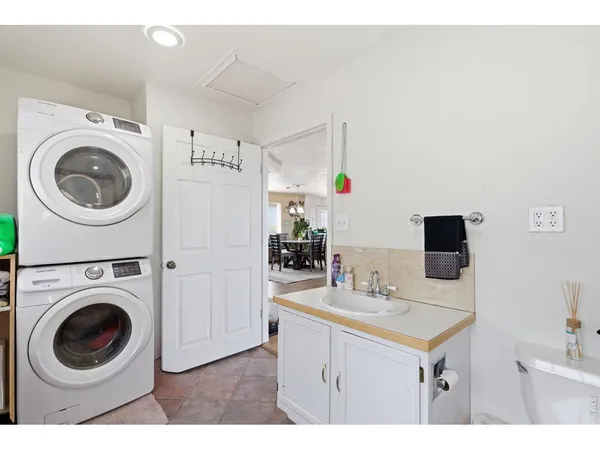 a bathroom with a sink and a washer