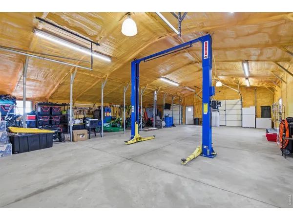 a view of a street with tables and chairs