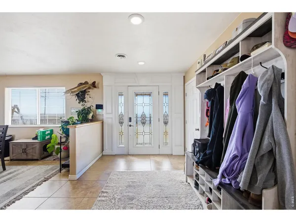 a view of a living room and entryway