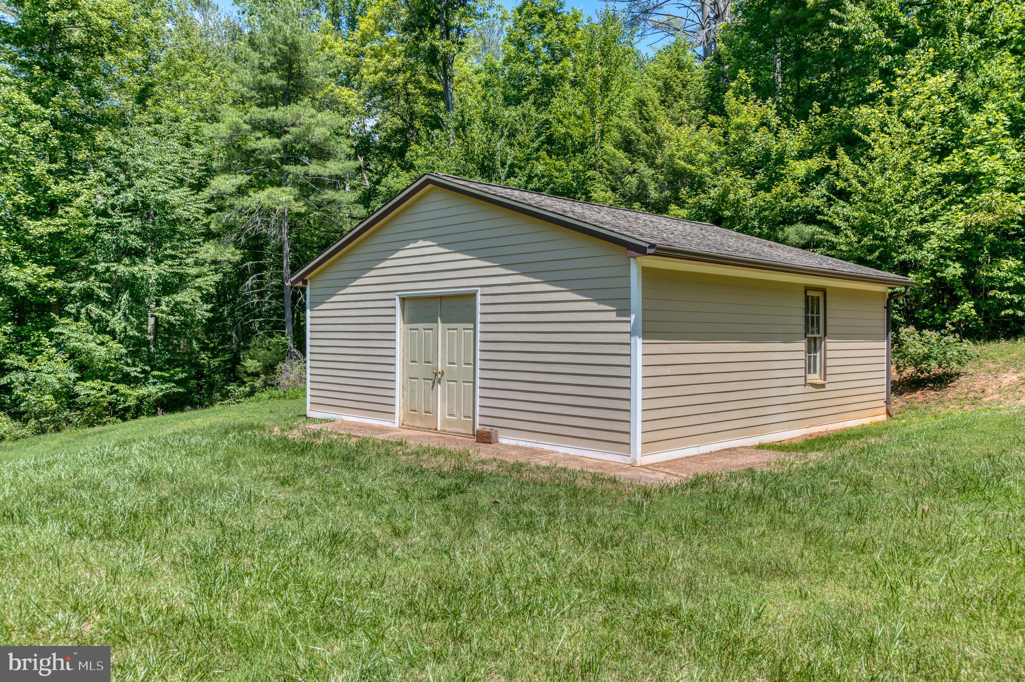 803 Weaver Hollow Road Banco, VA 22711 - Photo 33 of 67 a view of a house with a yard