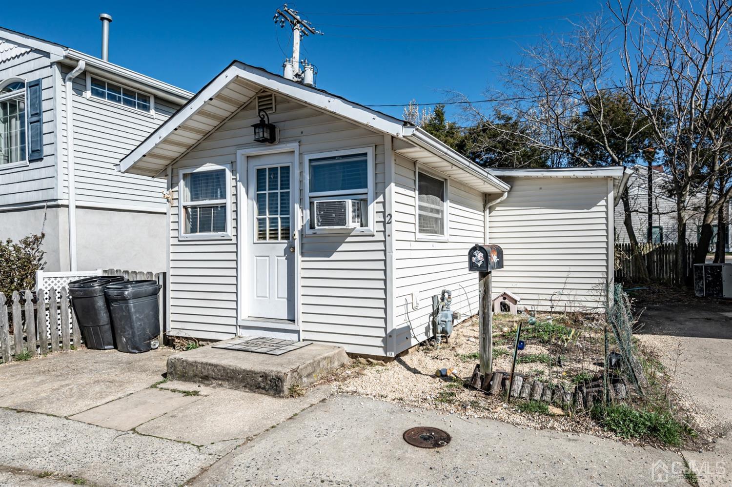 2 Neptune Place Keansburg, NJ 07734 - Photo 2 of 6 a front view of a house with a yard