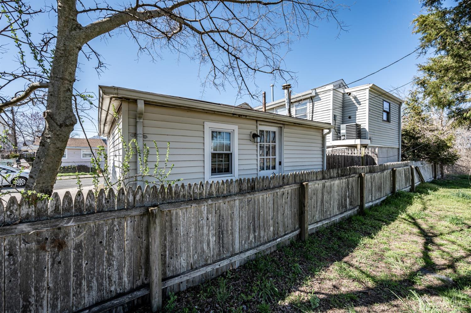 2 Neptune Place Keansburg, NJ 07734 - Photo 4 of 6 a view of a house with a wooden fence