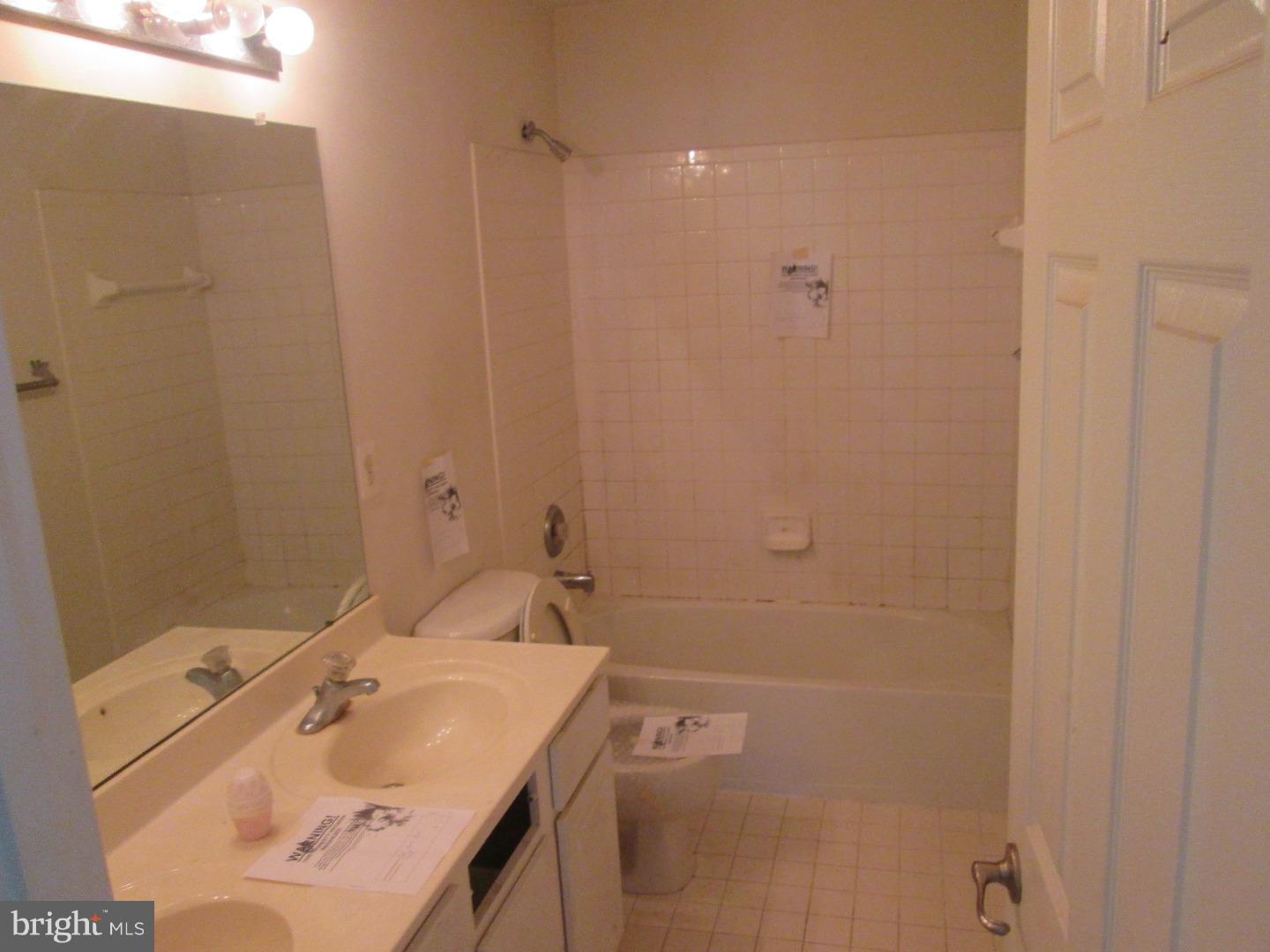 601 Crossover Court Frederick, MD 21703 - Photo 5 of 17 a bathroom with a sink vanity and shower