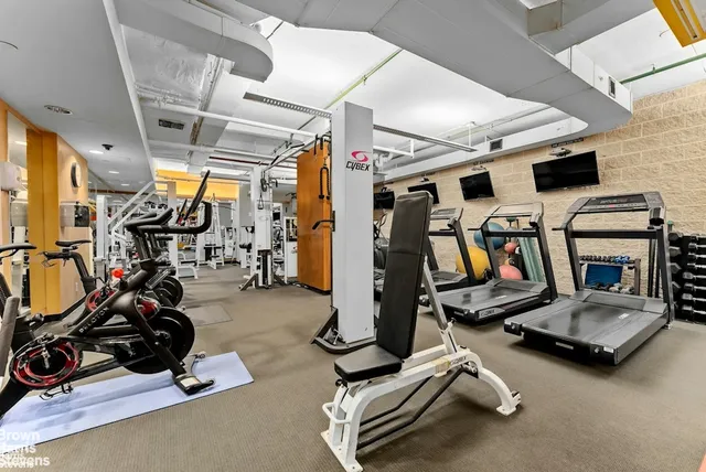 a bedroom with a bed and a table