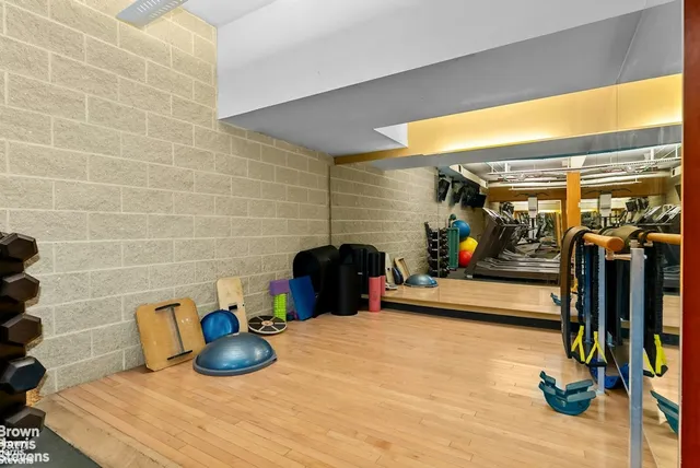 a living room with furniture and a piano