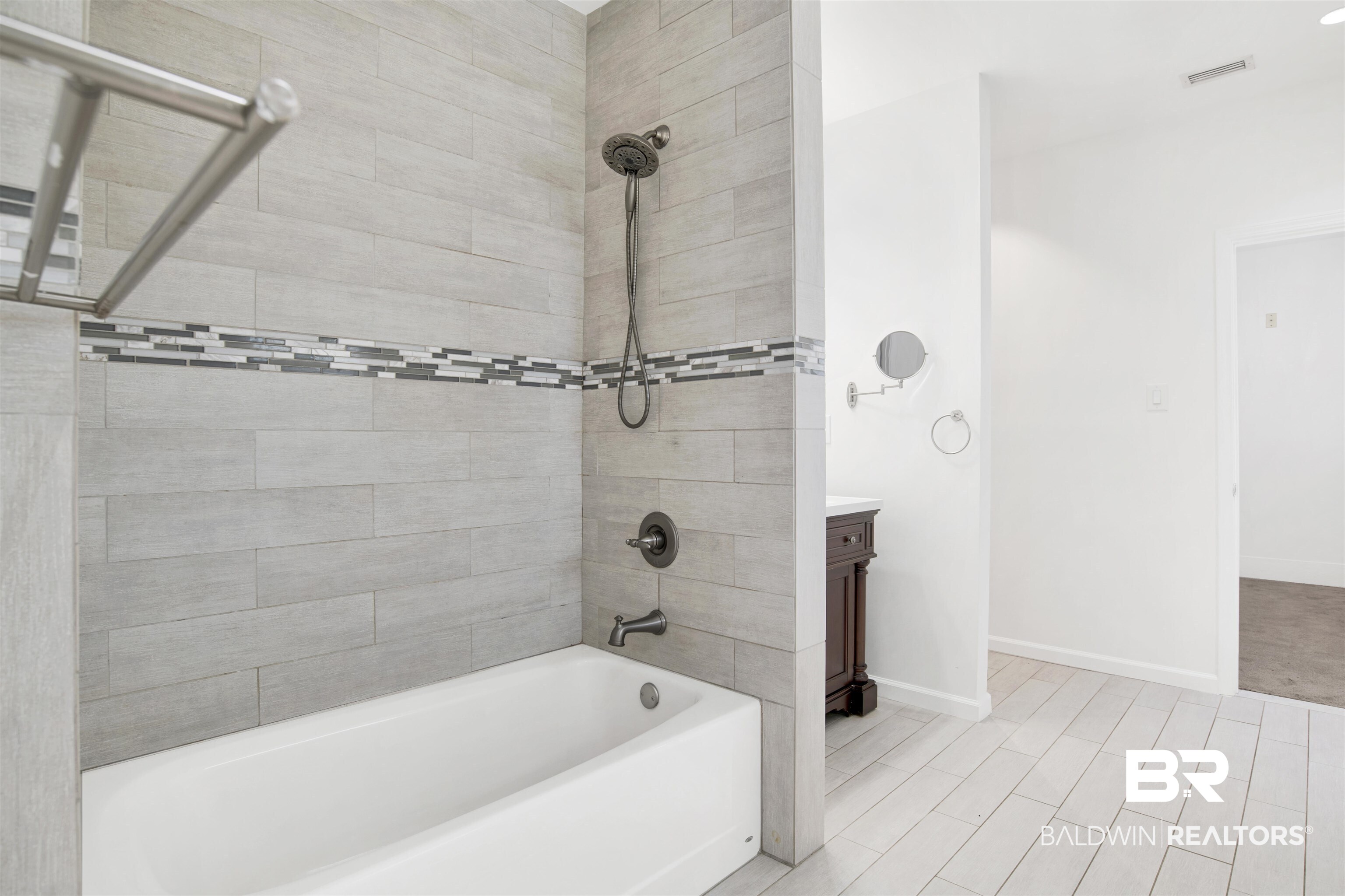 507 Holcombe Avenue Mobile, AL 36606 - Photo 28 of 28 Bathroom with vanity, baseboards, and shower / tub combination