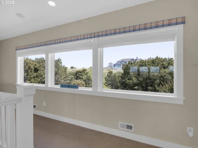 a view of a room that has a large window