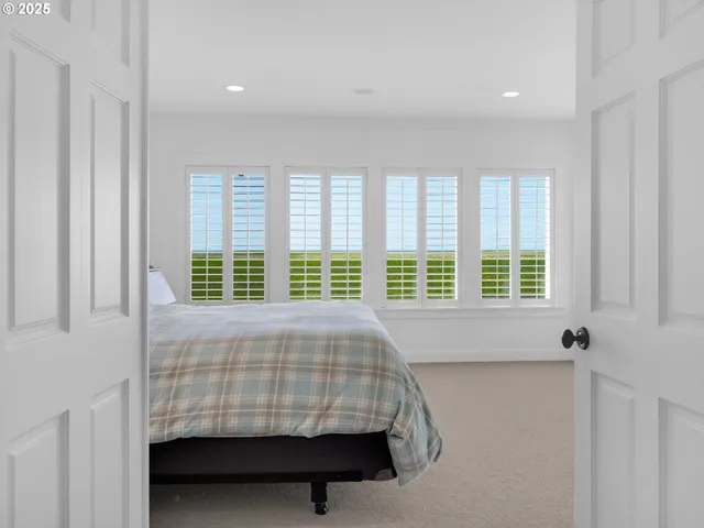 a bed sitting in a room next to a window