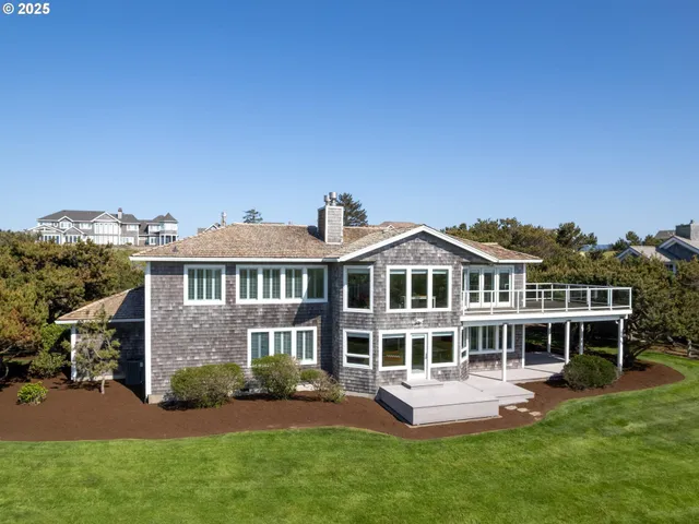 a front view of a house with a yard table and chairs
