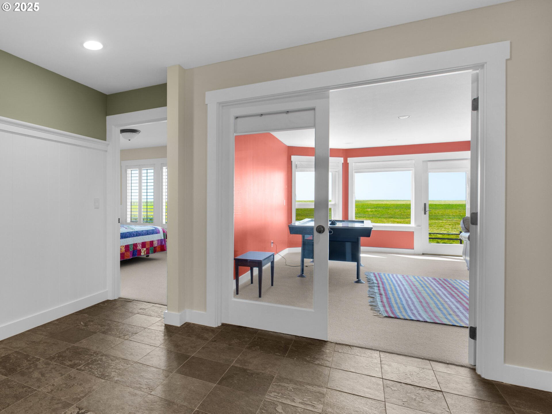 89185 Pinehurst Road Seaside, OR 97138 - Photo 25 of 48 a living room with furniture and large windows
