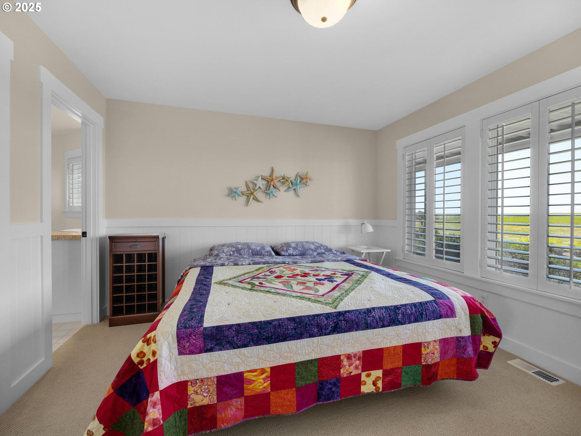 89185 Pinehurst Road Seaside, OR 97138 - Photo 29 of 48 a bedroom with a bed and a window