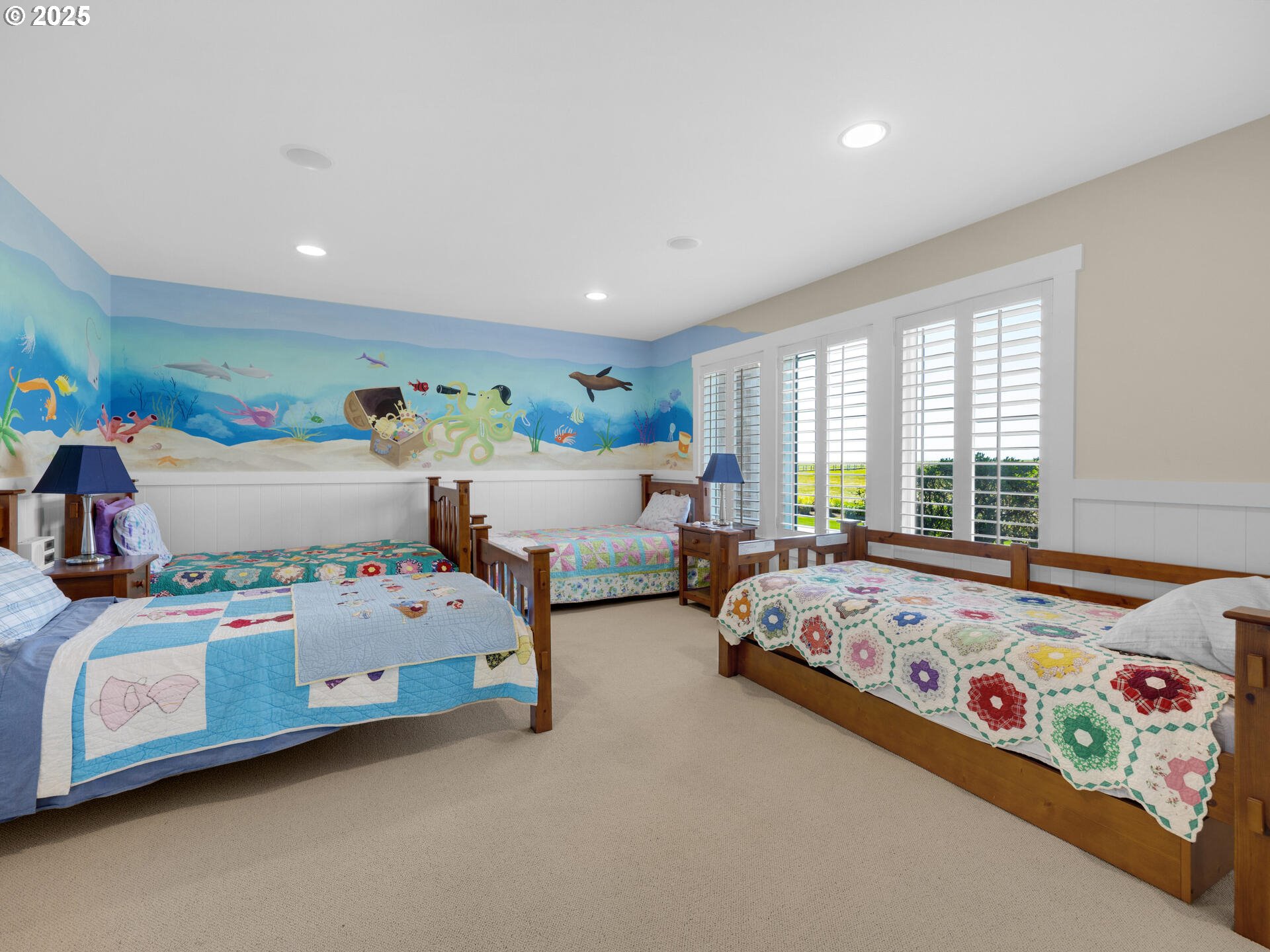 89185 Pinehurst Road Seaside, OR 97138 - Photo 33 of 48 a bedroom with two beds and a large window