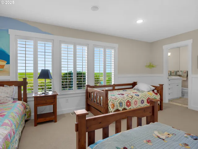 a bedroom with furniture and a window