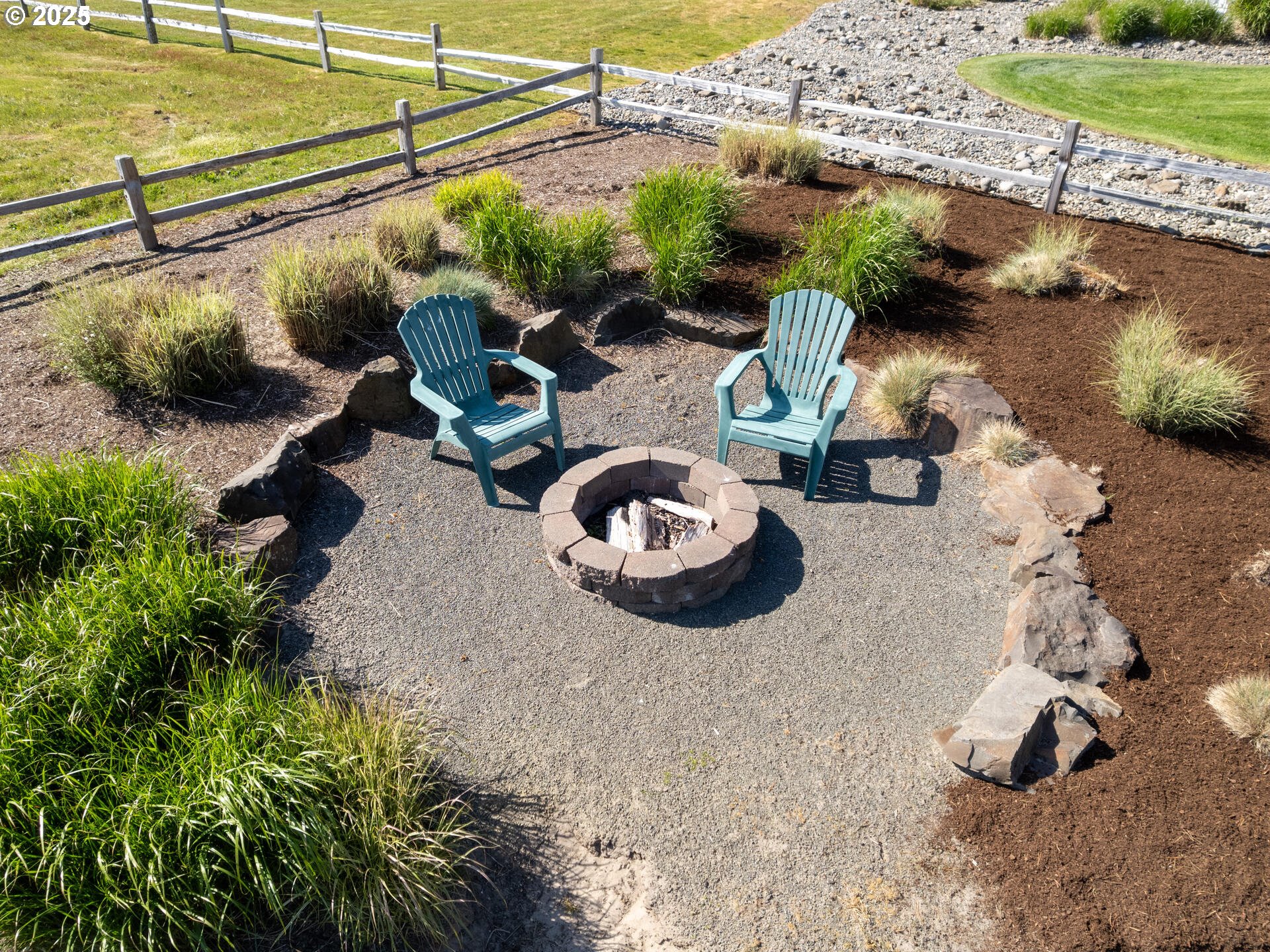 89185 Pinehurst Road Seaside, OR 97138 - Photo 40 of 48 a backyard of a house with lots of green space