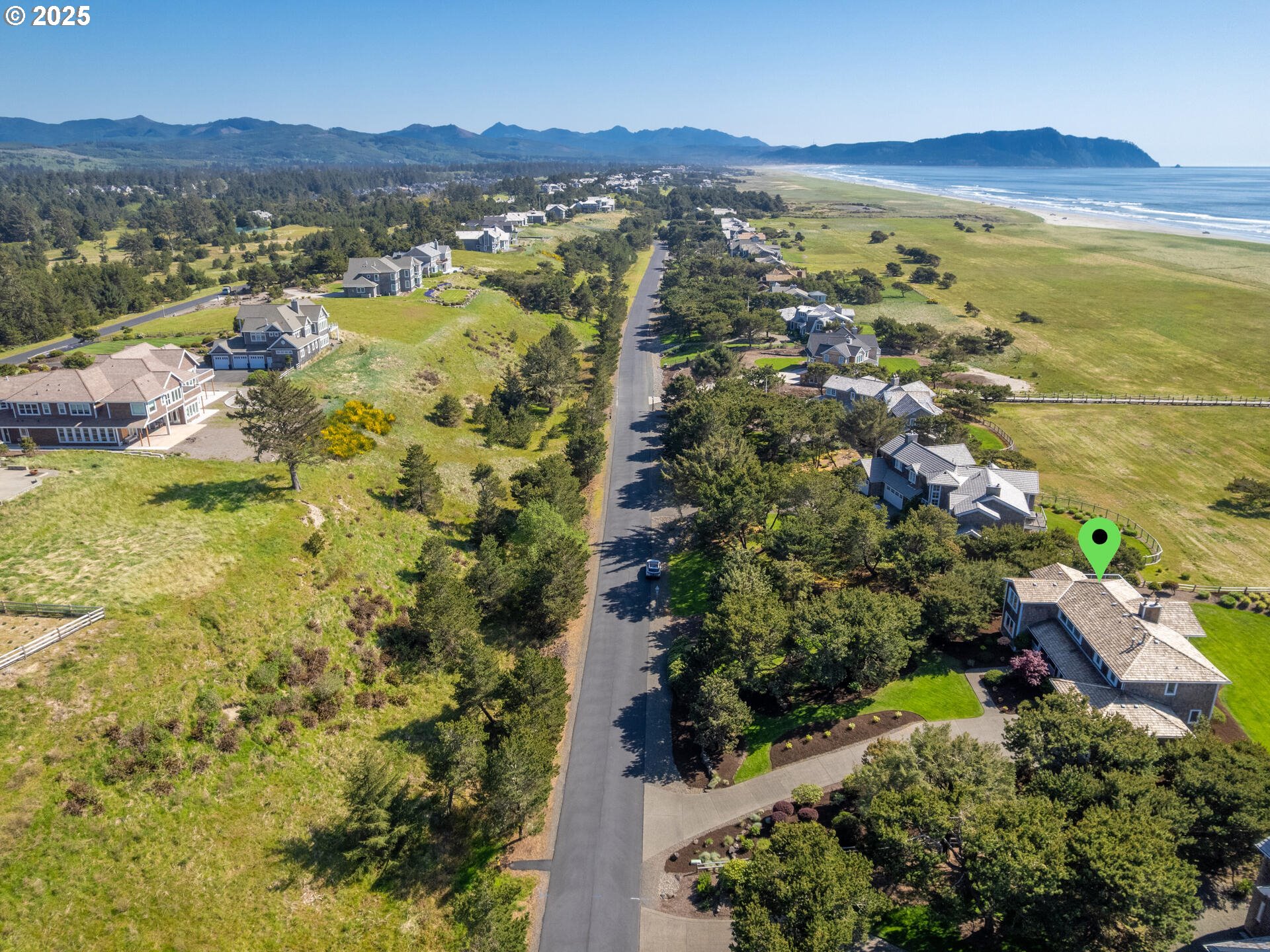 89185 Pinehurst Road Seaside, OR 97138 - Photo 44 of 48 a view of a city with mountains in the background