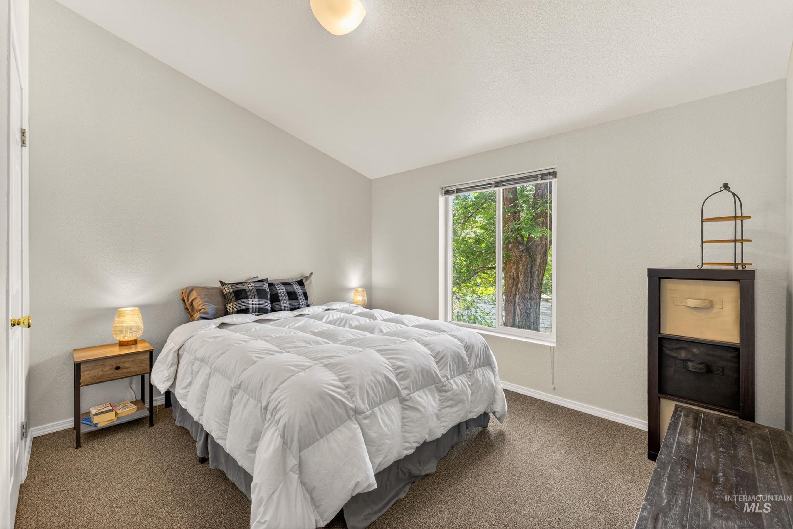 151 Cow Creek Road Lucile, ID 83542 - Photo 34 of 50 Bedroom featuring a vaulted ceiling and a single window offering natural light