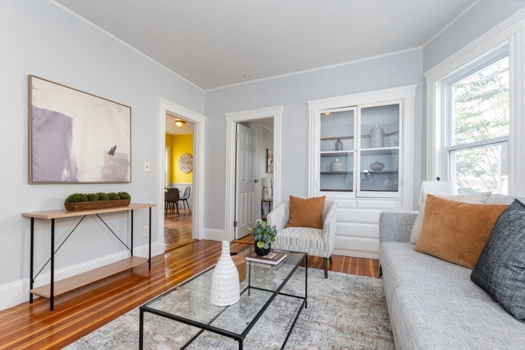 29 Mt Ida Road Boston, MA 02122 - Photo 2 of 22 a living room with furniture and a window