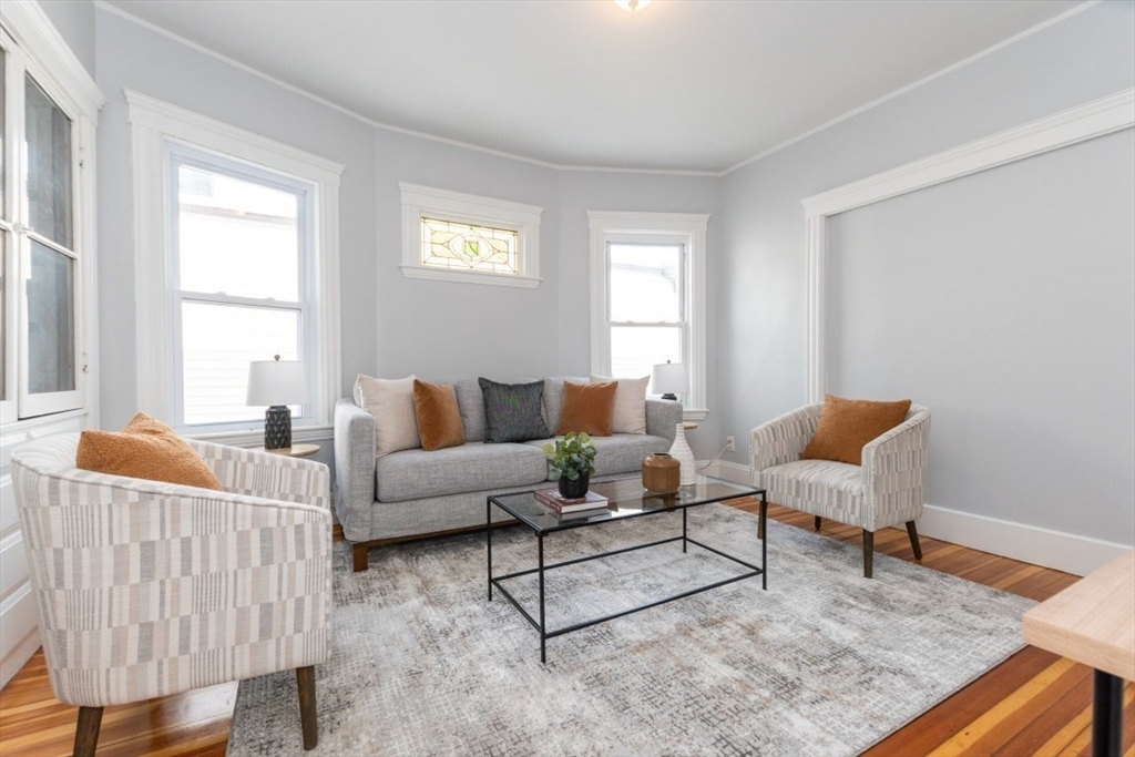 29 Mt Ida Road Boston, MA 02122 - Photo 3 of 22 a living room with furniture and a window