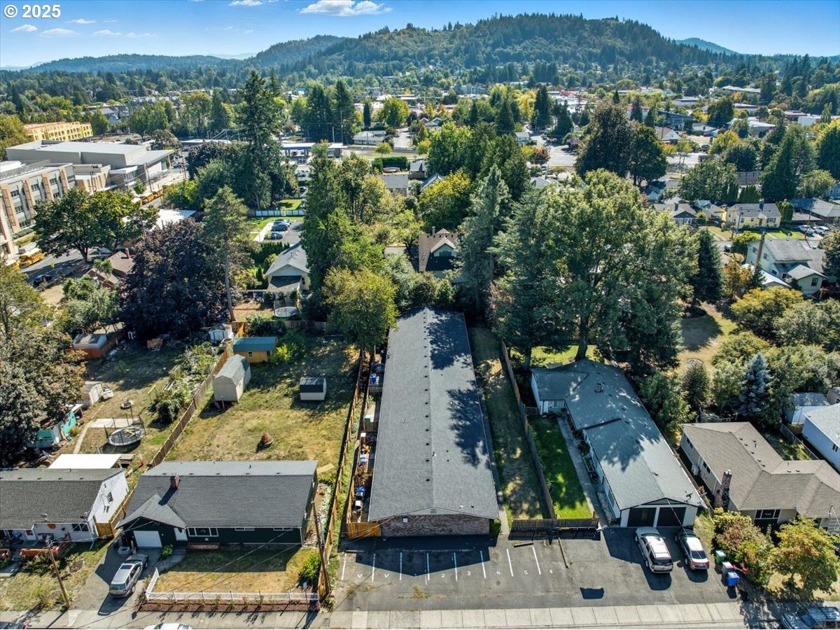 54 Northwest 13th Street Gresham, OR 97030 - Photo 13 of 20 an aerial view of residential houses with outdoor space and parking