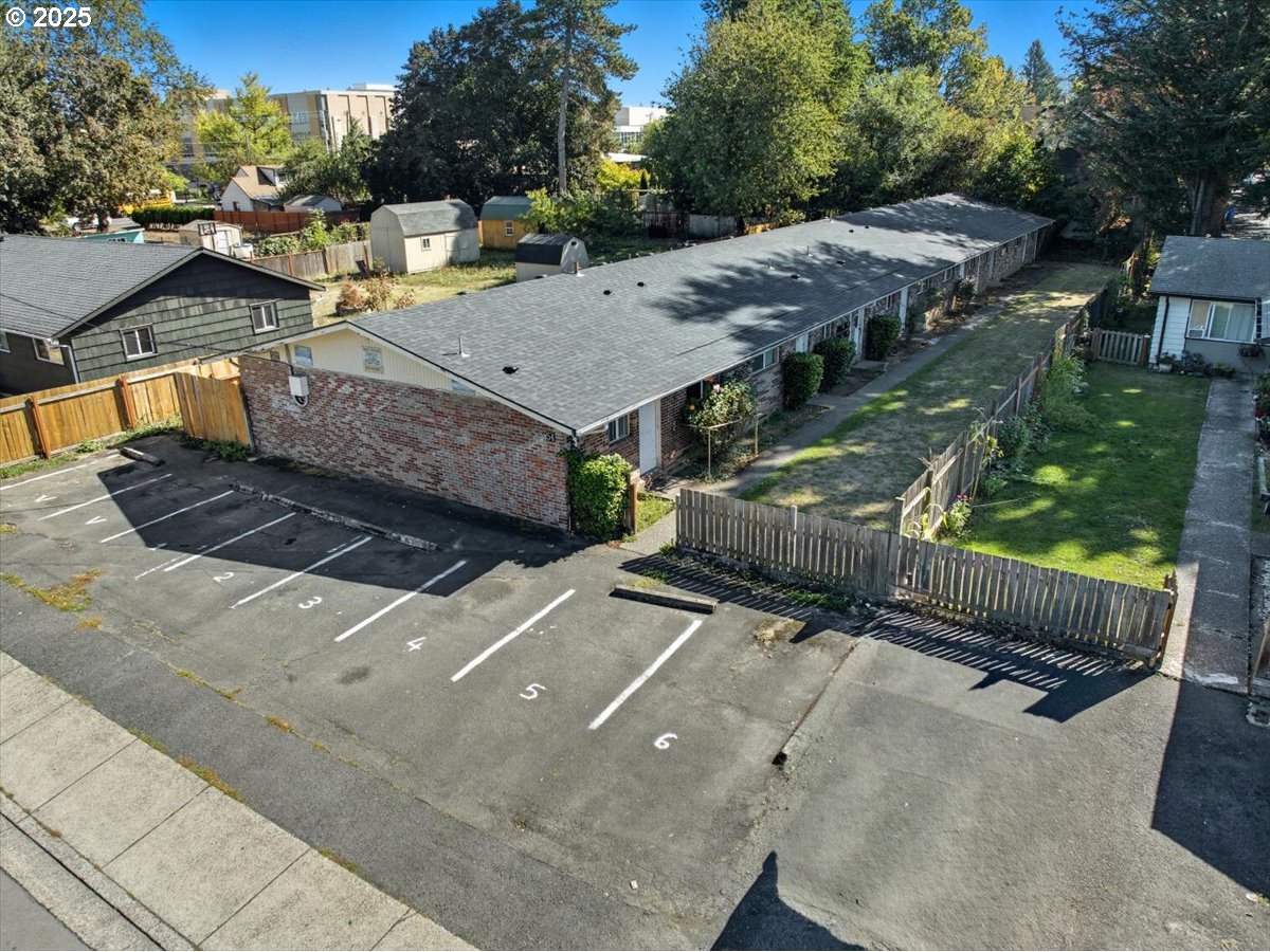 54 Northwest 13th Street Gresham, OR 97030 - Photo 8 of 20 a view of a patio with table and chairs and wooden fence