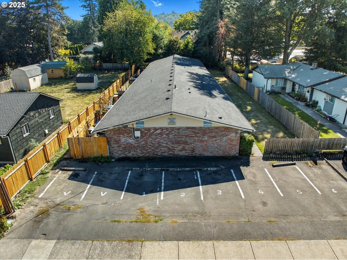 54 Northwest 13th Street Gresham, OR 97030 - Photo 9 of 20 a view of a patio with table and chairs with wooden floor and fence