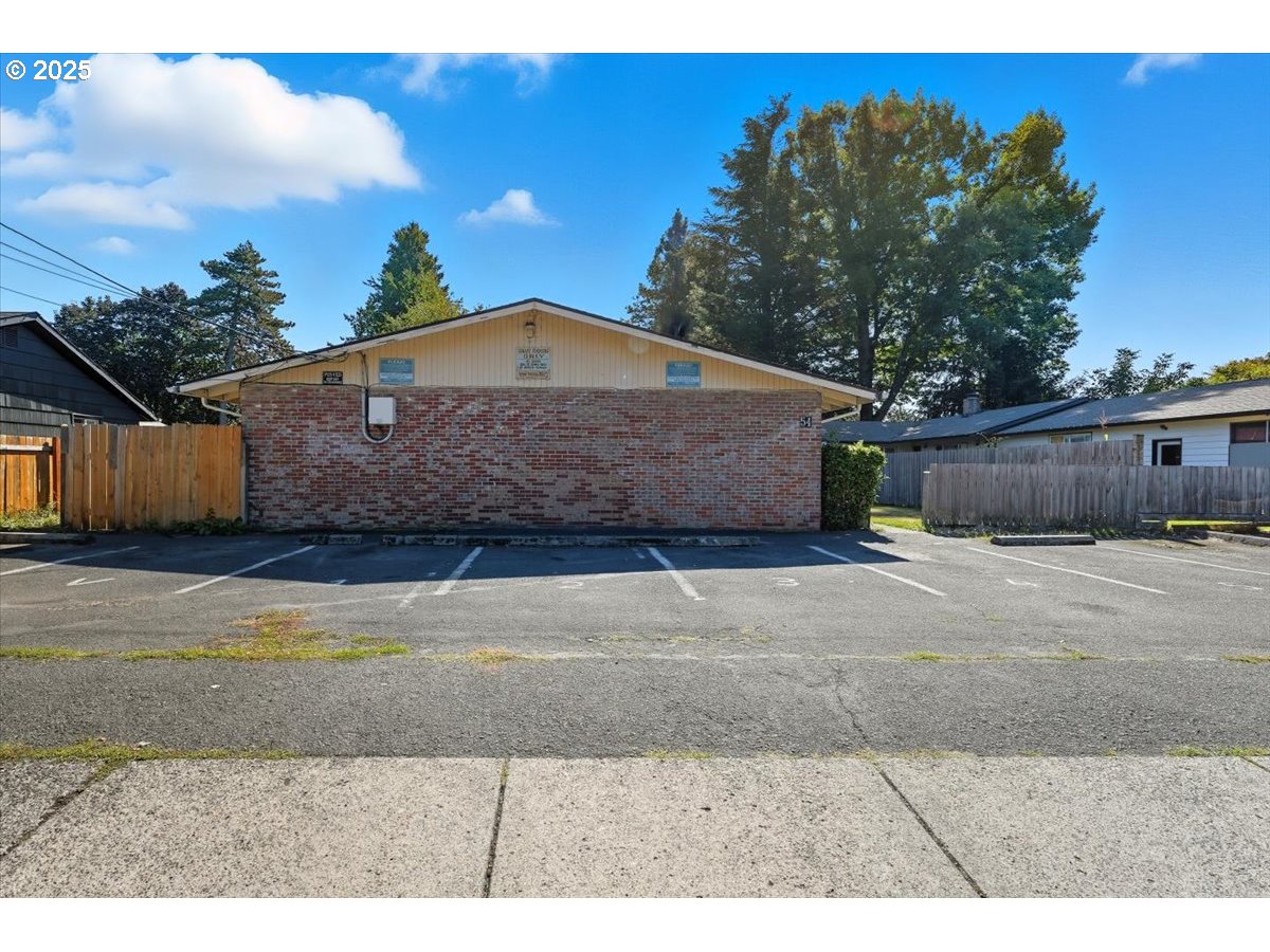 54 Northwest 13th Street Gresham, OR 97030 - Photo 10 of 20 a front view of a house with a yard and garage