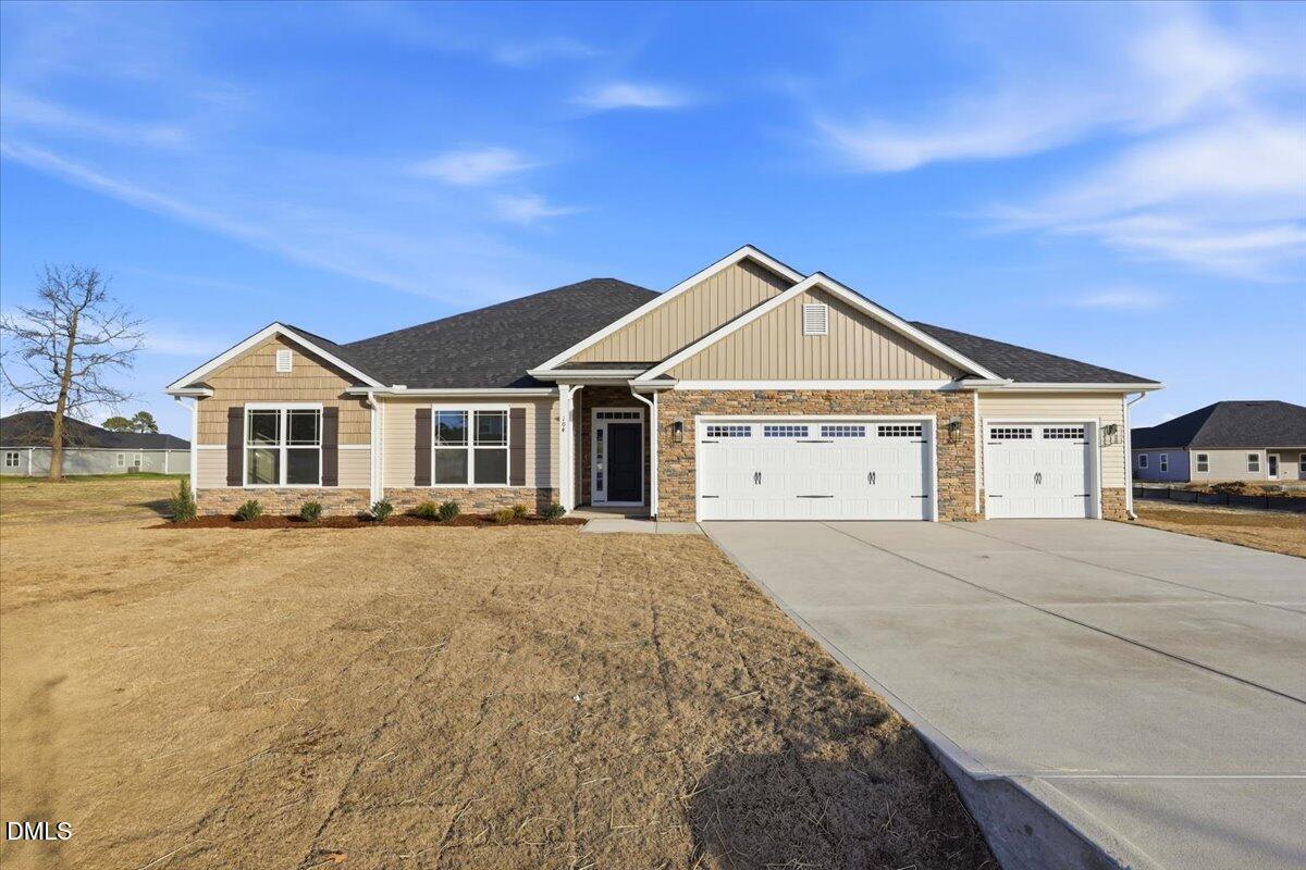 254 Galway Road Lillington, NC 27546 - Photo 1 of 35 a front view of a house with a yard