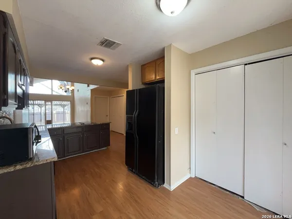 a view of hallway with wooden floor