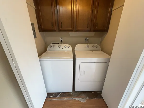 a view of storage and utility room with washer and dryer