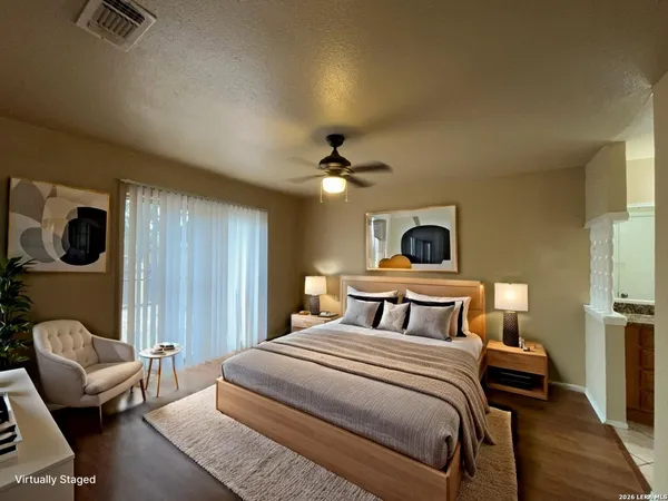 a bedroom with a large bed and a couch