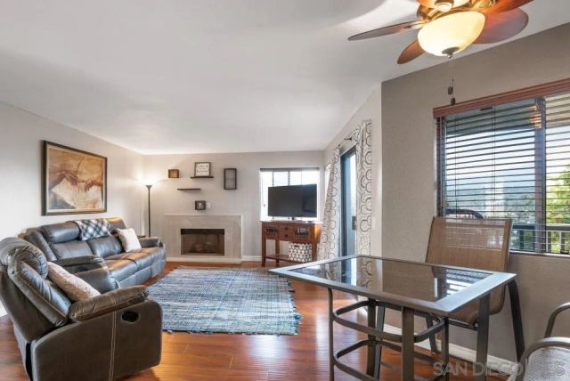 a living room with furniture dining table and a fireplace