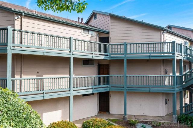 a front view of a house with garage